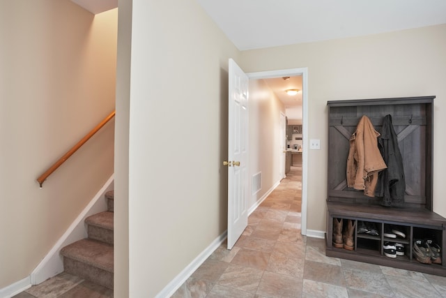 731 N Park Ave, Redding, CT 06896 - mudroom with baseboards and stone finish flooring