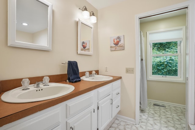 731 N Park Ave, Redding, CT 06896 - bathroom featuring double vanity and tile patterned floors