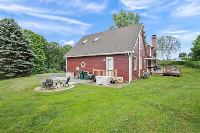 731 N Park Ave, Redding, CT 06896 - rear view of house featuring a fire pit, a chimney, a wooden deck, a lawn, and a shingled roof
