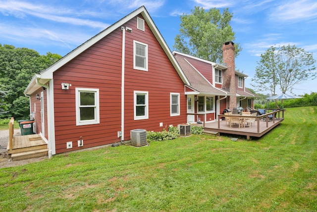 731 N Park Ave, Redding, CT 06896 - rear view of house with a yard, a deck, and a chimney