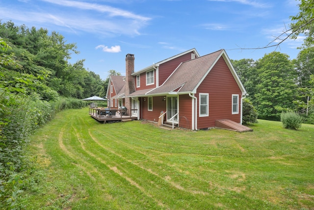 731 N Park Ave, Redding, CT 06896 - back of property featuring a chimney, a lawn, a deck, and a shingled roof