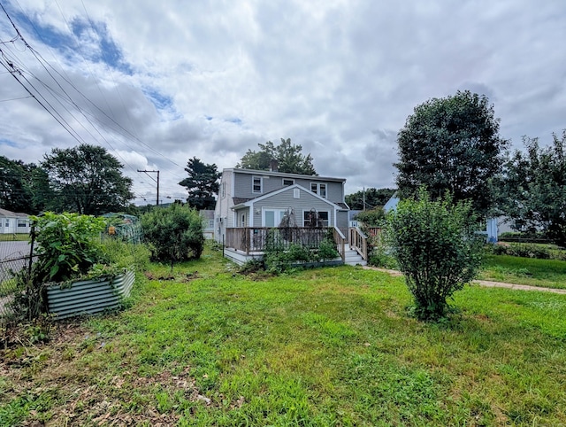 79 Dallas Ave, Plainville, CT 06062 - view of front of house with a front lawn and a wooden deck