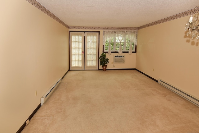 415 Lady Bug Ln Unit 415, Vernon, CT 06066 - spare room featuring a baseboard heating unit, a textured ceiling, light carpet, an AC wall unit, and french doors
