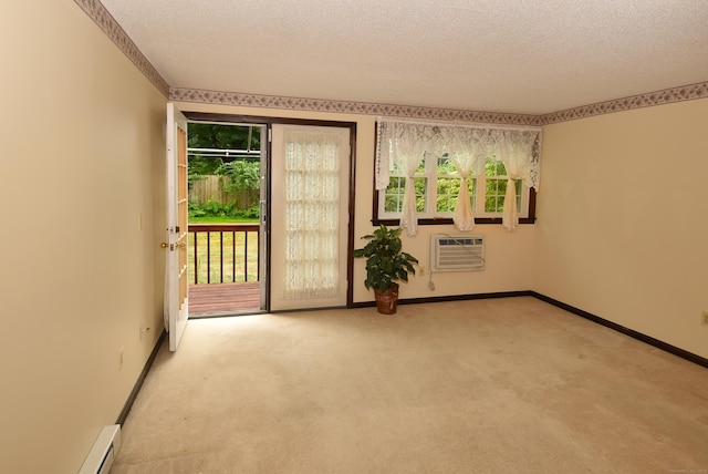 415 Lady Bug Ln Unit 415, Vernon, CT 06066 - empty room featuring a textured ceiling, healthy amount of natural light, carpet flooring, a wall mounted AC, and baseboard heating