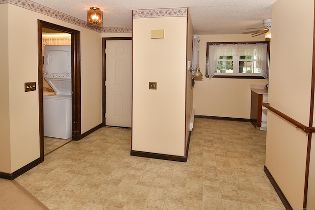 415 Lady Bug Ln Unit 415, Vernon, CT 06066 - hall with stacked washing machine and dryer and a textured ceiling