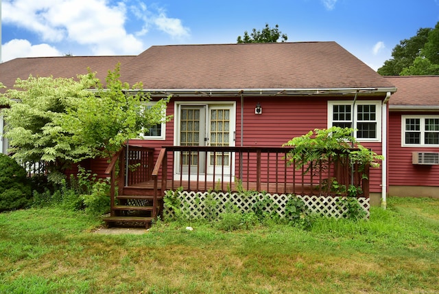 415 Lady Bug Ln Unit 415, Vernon, CT 06066 - back of house featuring a wooden deck, a wall unit AC, and a lawn