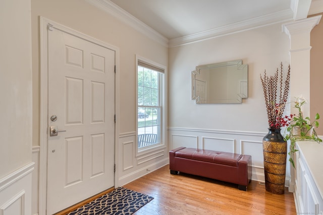 188 Sterling Dr Unit 188, Newington, CT 06111 - foyer featuring light wood-type flooring, ornamental molding, a decorative wall, wainscoting, and ornate columns