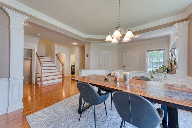 188 Sterling Dr Unit 188, Newington, CT 06111 - dining area with stairway, a chandelier, light wood finished floors, washer / dryer, and crown molding
