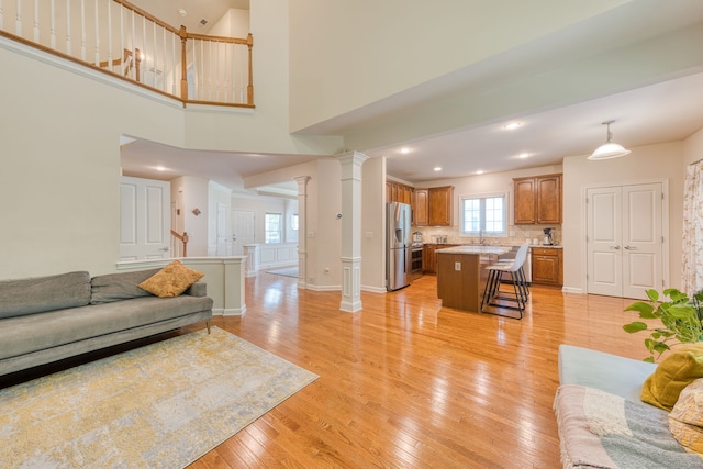 188 Sterling Dr Unit 188, Newington, CT 06111 - living room with light wood-style flooring, decorative columns, and recessed lighting