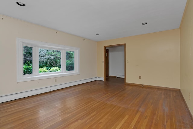 27 Tuttle Ct, Bethany, CT 06524 - spare room with wood finished floors, a baseboard heating unit, and recessed lighting