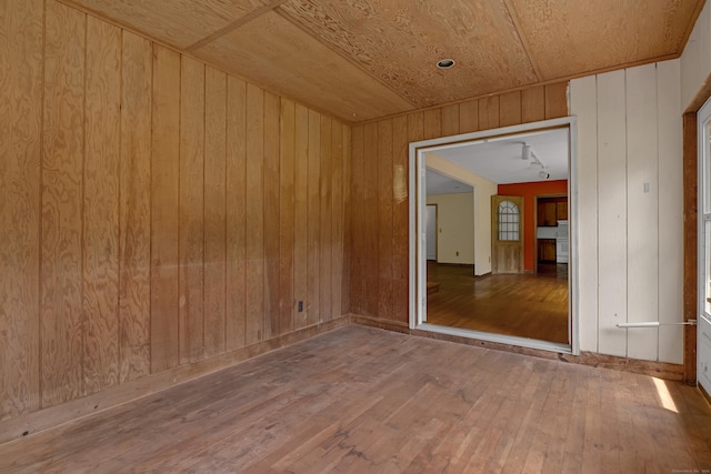 27 Tuttle Ct, Bethany, CT 06524 - spare room with hardwood / wood-style floors and wood walls