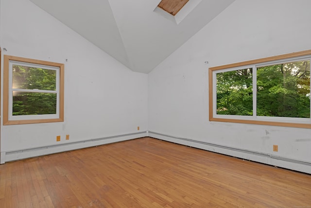 27 Tuttle Ct, Bethany, CT 06524 - unfurnished room with baseboard heating, lofted ceiling, plenty of natural light, hardwood / wood-style floors, and a skylight