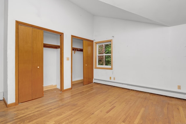 27 Tuttle Ct, Bethany, CT 06524 - unfurnished bedroom with a baseboard radiator, light wood-style floors, multiple closets, and high vaulted ceiling