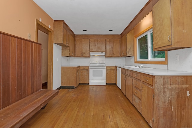 27 Tuttle Ct, Bethany, CT 06524 - kitchen featuring white appliances, under cabinet range hood, brown cabinetry, and light wood-style floors