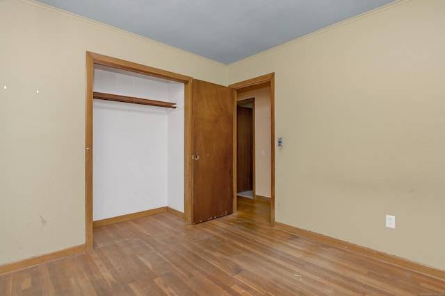 27 Tuttle Ct, Bethany, CT 06524 - unfurnished bedroom with wood finished floors, a closet, and ornamental molding