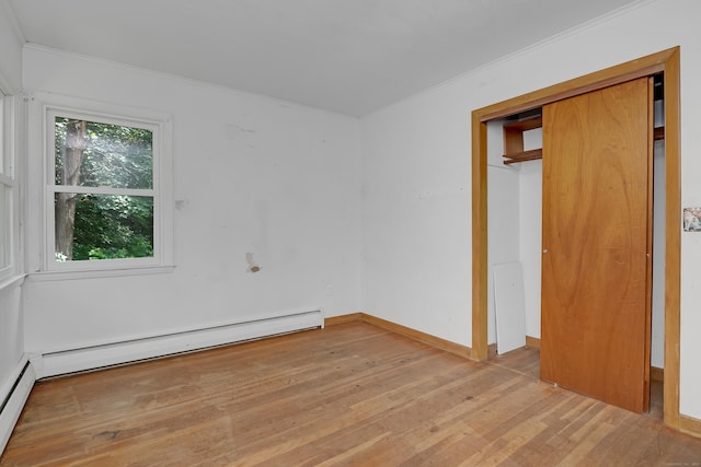 27 Tuttle Ct, Bethany, CT 06524 - unfurnished bedroom featuring light wood finished floors, crown molding, and a baseboard radiator