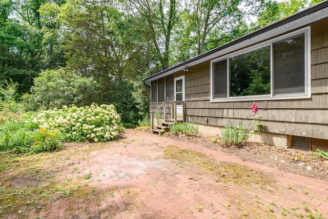 27 Tuttle Ct, Bethany, CT 06524 - view of side of property with a sunroom and a patio