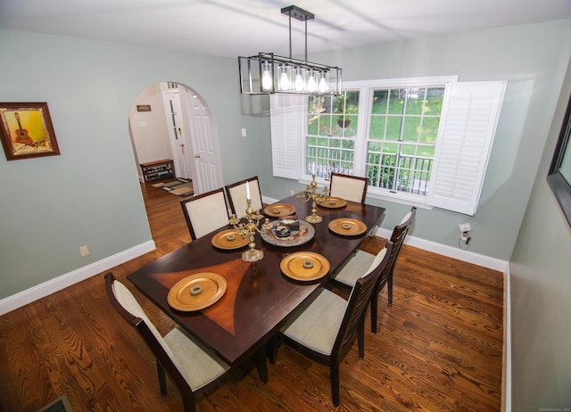 625 Lakeview Rd, Orange, CT 06477 - dining room featuring arched walkways and wood finished floors