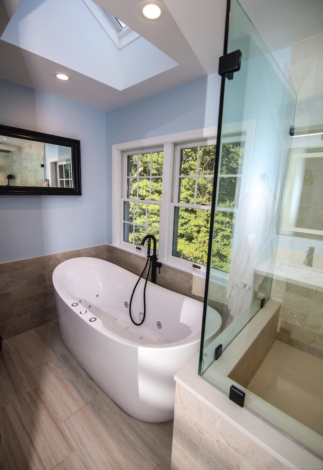 625 Lakeview Rd, Orange, CT 06477 - full bath with a skylight, a tub with jets, tiled shower, and recessed lighting