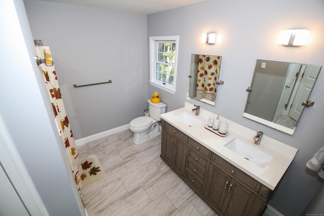 625 Lakeview Rd, Orange, CT 06477 - bathroom with double vanity and toilet