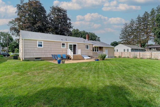 23 Sun St, Enfield, CT 06082 - rear view of house featuring entry steps, a patio area, and a chimney