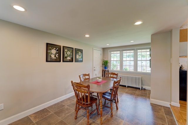 23 Sun St, Enfield, CT 06082 - dining area featuring radiator heating unit and recessed lighting