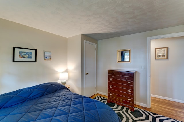 23 Sun St, Enfield, CT 06082 - bedroom featuring wood finished floors and a textured ceiling