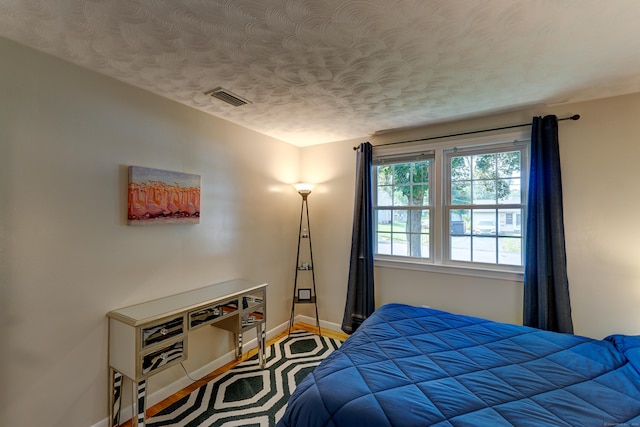23 Sun St, Enfield, CT 06082 - bedroom featuring baseboards and a textured ceiling
