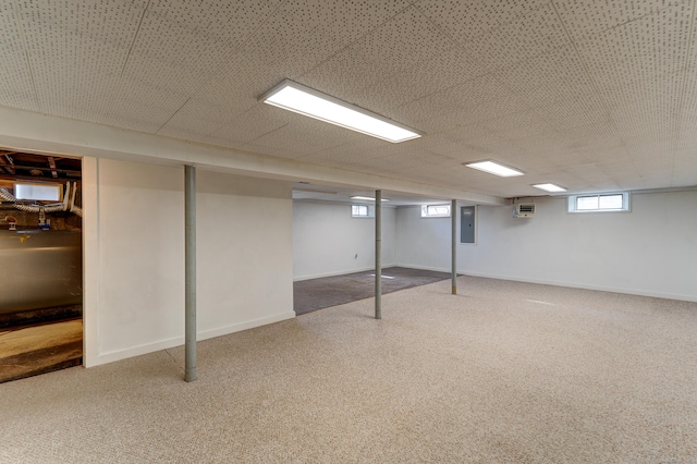 23 Sun St, Enfield, CT 06082 - below grade area with heating fuel, electric panel, carpet floors, and an AC wall unit