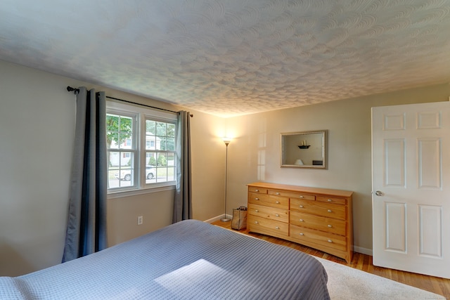 23 Sun St, Enfield, CT 06082 - bedroom featuring wood finished floors and a textured ceiling