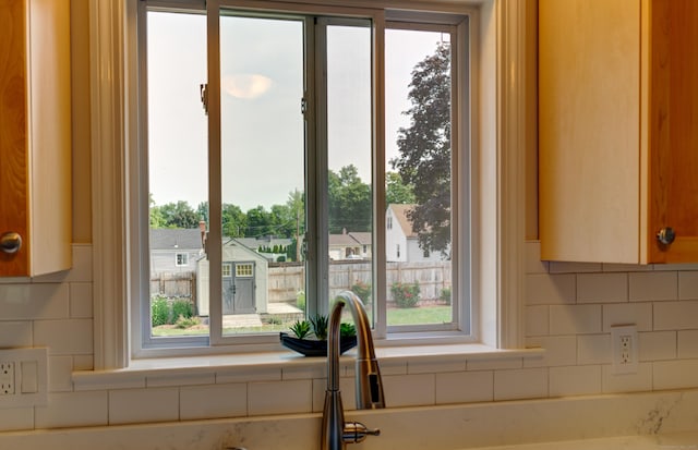 23 Sun St, Enfield, CT 06082 - kitchen with decorative backsplash and light countertops