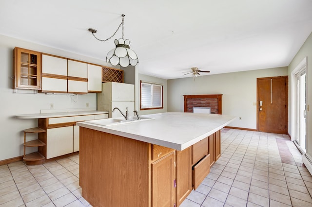 6 Victoria Dr, Colchester, CT 06415 - kitchen featuring freestanding refrigerator, light tile patterned floors, light countertops, and healthy amount of natural light