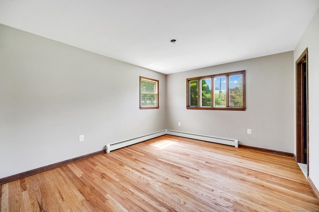 6 Victoria Dr, Colchester, CT 06415 - unfurnished room with wood finished floors and a baseboard heating unit