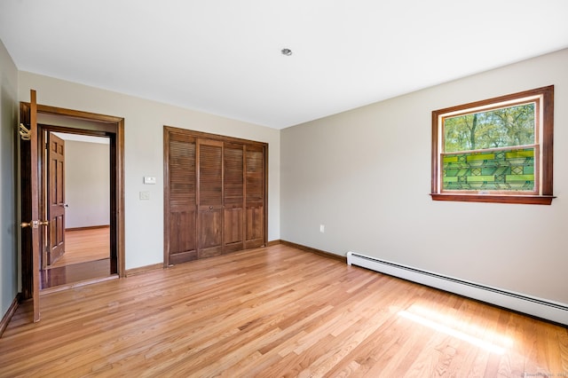 6 Victoria Dr, Colchester, CT 06415 - unfurnished bedroom featuring baseboard heating, light wood-style floors, and a closet
