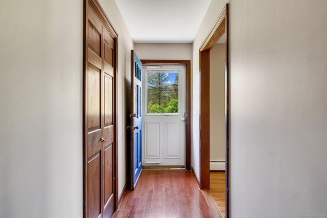 6 Victoria Dr, Colchester, CT 06415 - doorway to outside with wood finished floors and a baseboard heating unit