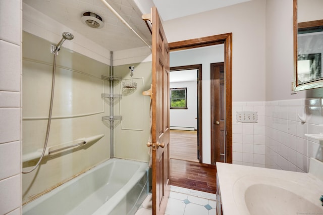 6 Victoria Dr, Colchester, CT 06415 - full bathroom featuring a baseboard heating unit, shower / tub combination, vanity, tile walls, and tile patterned floors