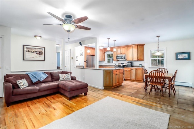135 Green Pond Rd, Sherman, CT 06784 - living room featuring light wood-style floors, ceiling fan, plenty of natural light, and a baseboard radiator