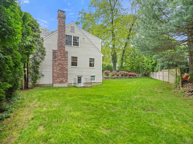 22 Rocky Ridge Dr, Trumbull, CT 06611 - rear view of house with a chimney