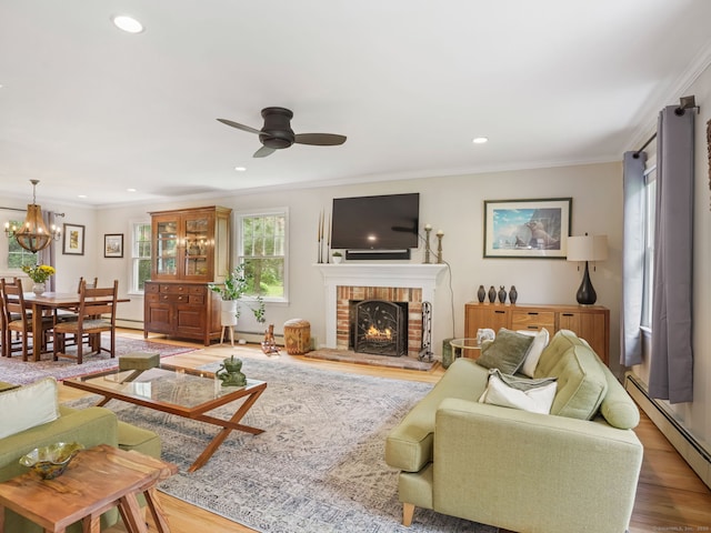 22 Rocky Ridge Dr, Trumbull, CT 06611 - living room featuring a baseboard radiator, wood finished floors, a ceiling fan, ornamental molding, and a fireplace