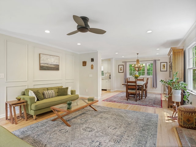 22 Rocky Ridge Dr, Trumbull, CT 06611 - living area featuring ornamental molding, a chandelier, ceiling fan, light wood-type flooring, and recessed lighting