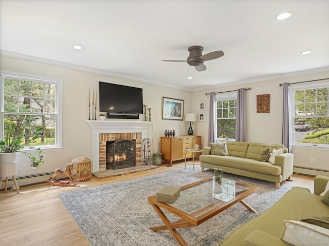 22 Rocky Ridge Dr, Trumbull, CT 06611 - living area featuring a ceiling fan, a brick fireplace, wood finished floors, crown molding, and recessed lighting