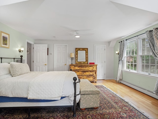 22 Rocky Ridge Dr, Trumbull, CT 06611 - bedroom with light wood-style flooring, baseboard heating, and a ceiling fan