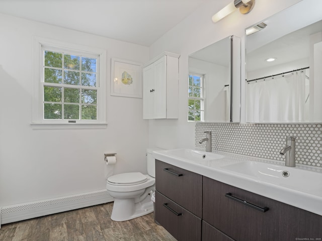 22 Rocky Ridge Dr, Trumbull, CT 06611 - full bathroom featuring a baseboard radiator, decorative backsplash, double vanity, and wood finished floors