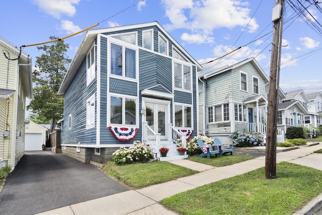 35 Lawrence Ave, Milford, CT 06460 - view of front of home featuring an outbuilding, entry steps, and a garage