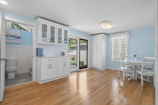35 Lawrence Ave, Milford, CT 06460 - bar with light wood-style floors and wainscoting