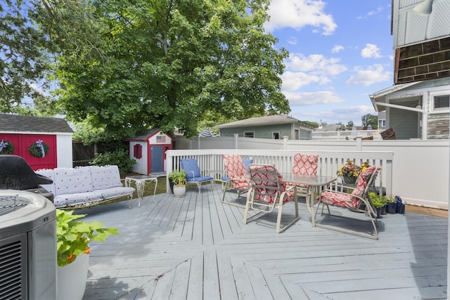 35 Lawrence Ave, Milford, CT 06460 - wooden deck featuring a shed and outdoor dining space