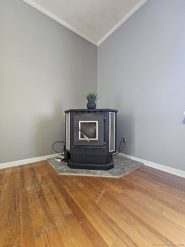 108 French St, Bristol, CT 06010 - detailed view of a wood stove, wood finished floors, and ornamental molding