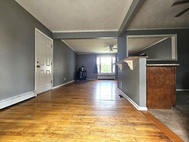 108 French St, Bristol, CT 06010 - unfurnished living room with a ceiling fan, hardwood / wood-style floors, radiator heating unit, ornamental molding, and baseboard heating