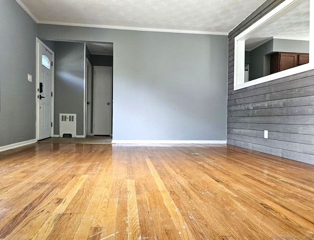 108 French St, Bristol, CT 06010 - unfurnished living room with light wood-type flooring and crown molding