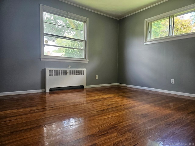 108 French St, Bristol, CT 06010 - spare room featuring radiator heating unit, crown molding, healthy amount of natural light, and wood finished floors